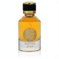 Rihanah Shayoukh unisex EDP spray: clear glass bottle, rich amber fragrance, luxurious gold cap, elegant gold Arabic label.