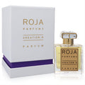 Roja Creation-R Extrait De Parfum: elegant clear glass bottle with gold label, faceted crystal cap, beside its white & purple box.