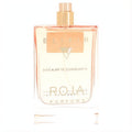 Luxurious Roja Elixir 3.4 oz fragrance bottle: clear glass, peach liquid, elegant gold cap.