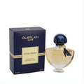 Guerlain Shalimar 1 oz EDT spray. Elegant clear glass bottle with golden liquid, blue cap, black ribbon, and navy box.