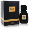 Ajmal Santal Wood 3.4 oz unisex Eau De Parfum. Sleek black bottle with geometric cap and gold label, beside a matching textured black and gold box.