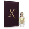 Captivating Xerjoff Oesel EDP: clear glass bottle with gold cap & light yellow liquid, beside a rich burgundy box with gold 'X' logo.