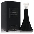 Christian Siriano Silhouette Midnight 3.4 oz EDP. Striking matte black bottle with a unique flared silhouette and clear faceted cap, next to its elegant box.