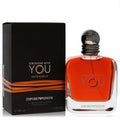 Stronger With You Intensely 3.4 oz men's cologne. Amber liquid in a sleek bottle with a dark metallic cap, next to its black and orange box.