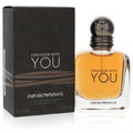 Stronger With You 1.7 oz men's EDT: golden amber fragrance in a modern clear bottle with dark cap, next to its stylish black box.