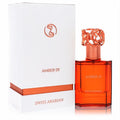 Luxurious Swiss Arabian Amber 01 Eau De Parfum 1.7 oz. Vibrant amber bottle, intricate rose gold cap, and elegant white box.