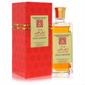 Luxurious Swiss Arabian Layali El Ons 95ml concentrated perfume oil. Clear bottle with golden liquid, cap, and ornate red box.