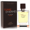 Terre D'hermes Eau Intense Vetiver 1.6 oz EDP. Clear glass bottle with warm amber liquid, dark brown cap, and elegant brown box.