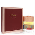 Exquisite Spirit of Dubai Majalis 1.7 oz EDP. Features an ornate bottle with a vibrant carpet pattern and a rich maroon & rose gold box.