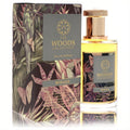 Elegant Woods Collection Mirage unisex Eau De Parfum, 3.4 oz. Clear bottle with gold cap and exotic tropical art on label and matching box.
