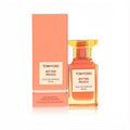 Elegant Tom Ford Bitter Peach 1.7 oz (50ml) unisex Eau De Parfum spray in a peach-amber glass bottle with matching box.
