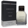 Elevate your scent with Tumi Awaken 3.4 oz EDP. Sleek clear bottle, dark cap with red accent, and modern black box.