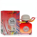 Tutti Twilly d'Hermès 2.7 oz Eau De Parfum. Red ombre bottle, white bowler hat cap, vibrant twilly, and artistic box.