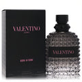 Valentino Uomo Born In Roma 3.4 oz men's EDT. Distinctive black studded glass bottle with pink logo and sleek black box.