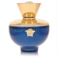 Luxurious Versace Dylan Blue perfume bottle, deep royal blue glass with a gleaming gold cap and iconic Medusa emblem.