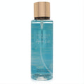 Victoria's Secret Aqua Kiss 8.4 oz fragrance mist. Clear bottle, vibrant blue liquid, sleek rose gold cap.