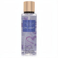 Victoria's Secret Love Addict women's 8.4 oz fragrance mist. Clear bottle, purple liquid, gold cap, and romantic heart design.
