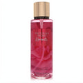 Victoria's Secret Romantic 8.4 oz fragrance mist. Clear bottle with vibrant pink liquid, luxurious gold cap, and elegant floral design.