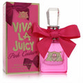 Vibrant 1 oz Viva La Juicy Pink Couture perfume bottle with a chic pink satin bow, gold emblem, and matching box.