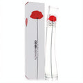 Kenzo Flower 1.7 oz Eau De Parfum. Iconic clear glass bottle with a vibrant red poppy stem, presented with its elegant white box.