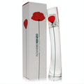 Stunning Kenzo Flower 1 oz Eau De Toilette. Clear glass bottle with vibrant red poppy, beside its elegant white floral box.